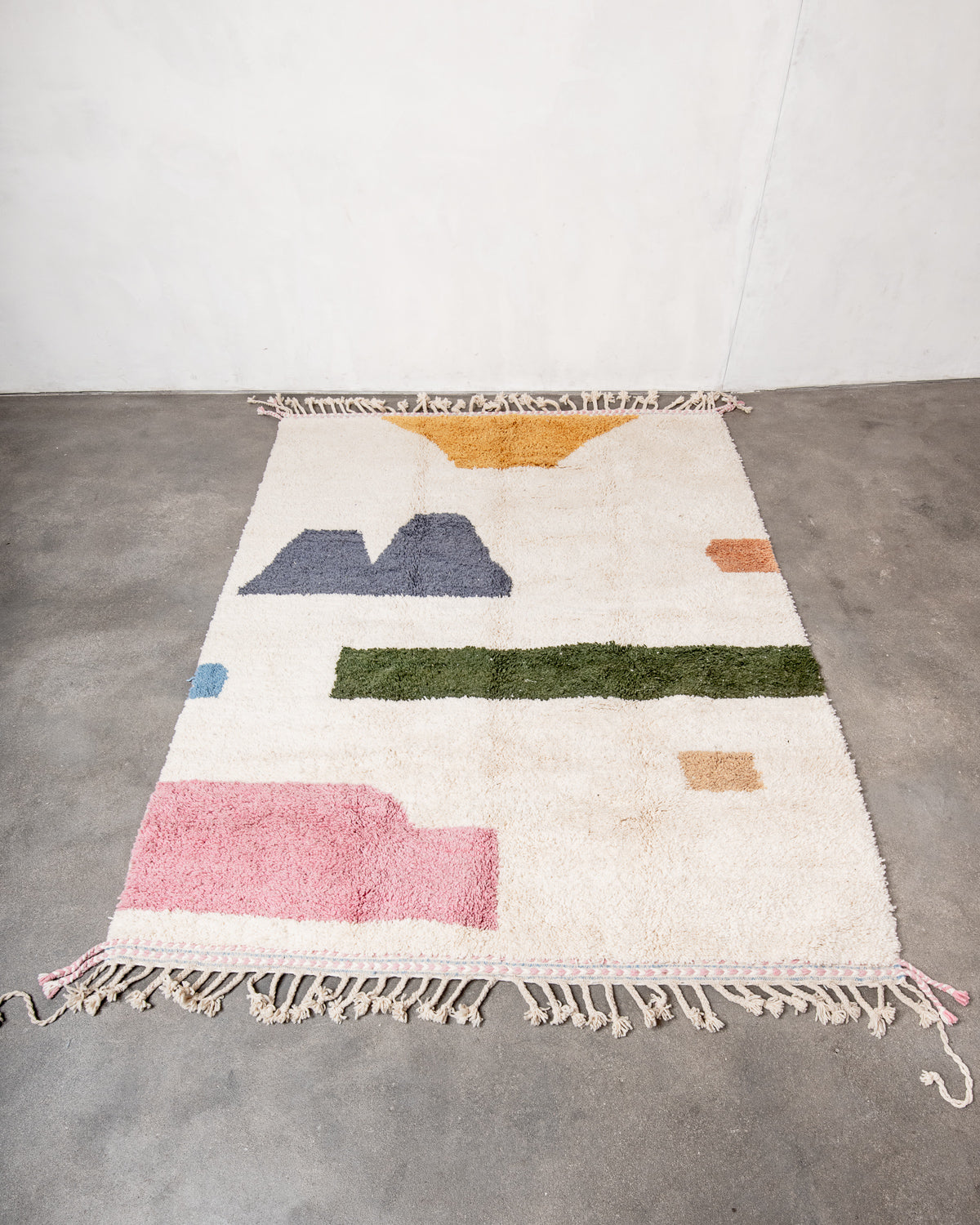 Modern, designer, handcrafted Berber rug from Morocco. Beniourain carpet with beautiful colours and patterns and fluffy wool texture.